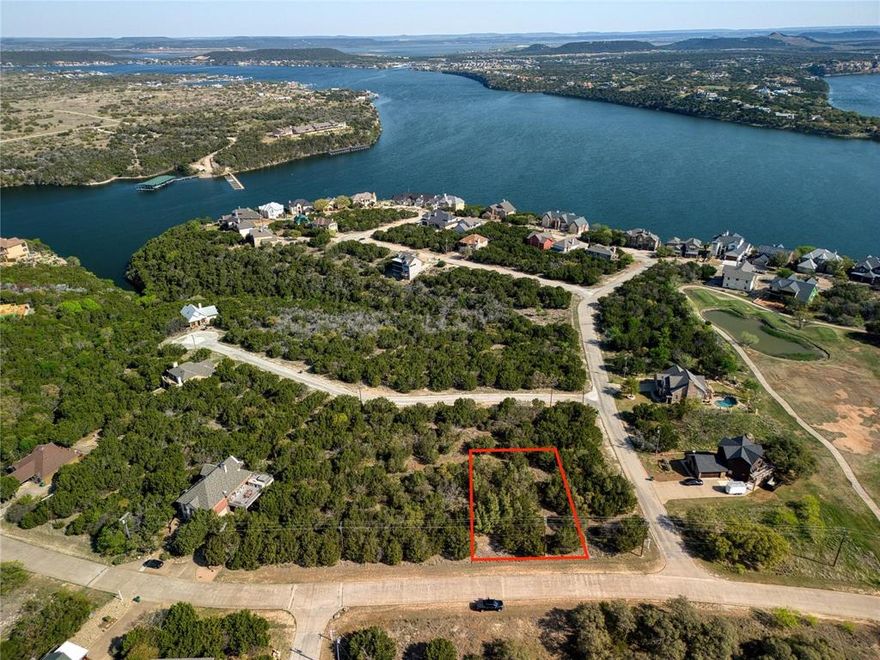 If you've been looking for a place to enjoy a resort lifestyle that includes lake access, golf access, on-site dining, and
much more ~ here it is! This home site is located on the main drive of The Cliffs Resort at Possum Kingdom Lake, just
minutes from the golf course, pool, and marina. The Cliffs is a well developed community with a great amenities
package, and there are already beautiful homes surrounding this location. Make your plans to see this ~ bring your
builder, or book a stay in the recently updated Inn at The Cliffs, and enjoy resort access and amenities until you're
ready to build! (no time requirement to start)
This lot has a un-buildable lot next to it, so you won't have neighbors on one side of you. Great easy access to the marina, golf course, and restaurant.