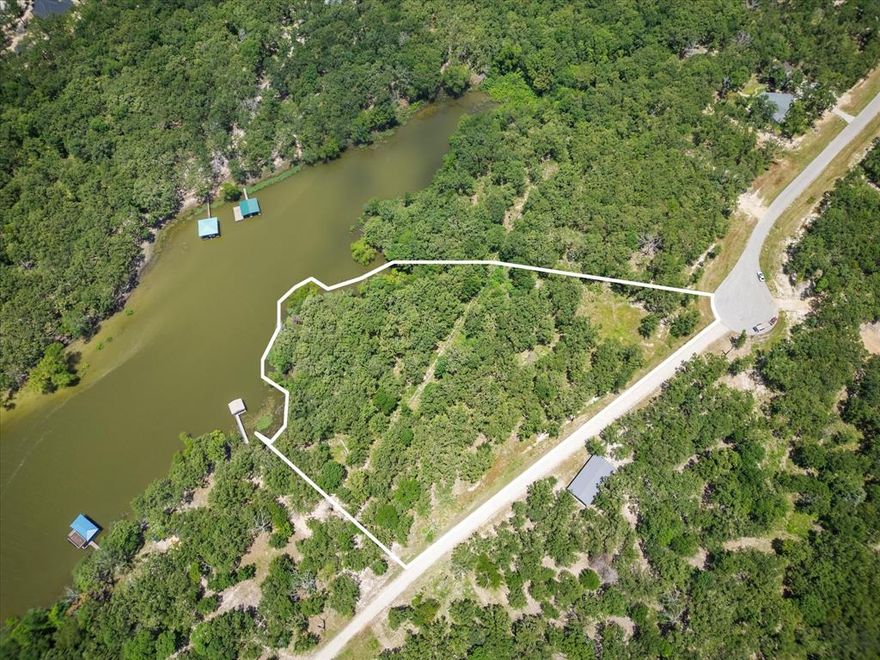 Located less than one hour from Dallas, this beautiful 1.27 acre waterfront homesite is located in the exclusive Nautical Shores neighborhood. Build your dream lake home, dock for your boat, and get ready to enjoy lake living! Spectacular lake views, beautiful sunsets, one of the best fishing lakes, and so much more! Exclusive use of the private 2.21 acre leaseback with 400 feet of shoreline from the SRA for $64 a year. Lot 46A on map. Bring your own builder, no manufactured homes. Yellow lines are approximate & include the leaseback portion. See map in pictures. GPS to 6990 CR 3516, Quinlan, TX 75474, this should get you to the entrance. Water and electric installed. Septic tank will need to be installed. One story homes must be at least 1200 sq ft and 2 stories at least 1800 sq ft. Survey is in the document section but the leaseback portion is not on the survey. Seller has cut down trees at the best building site per engineering. Engineering docs are available per request.