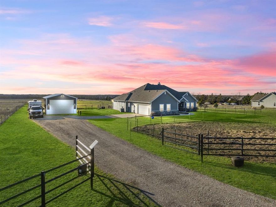 With gated 2.5 Acres of fenced and cross fenced land, big shop and barn, and beautiful home, this North Texas combo is hard to find! Sellers have thoughtfully planned and adapted the property for horses, would be perfect for youth FFA livestock as well. The Craftsman - Ranch influenced home is beautiful to the eye, practical for the ranching lifestyle. Gorgeous fireplace, open concept, walls of windows brings those country views inside. Kitchen is spacious, the large island is the gathering spot for family and friends. Walls of floor to ceiling cabinetry and granite counters, designer influenced finishes, beautiful and practical. The flow between living area, casual dining and kitchen is seamless. Main BR is spacious, ensuite is fantastic! Dual sinks and vanities, plenty of storage, granite counters, with garden tub, separate shower. Main bath connects to full size laundry area. Two additional bedrooms, similar in size, nice natural light. Additional spacious full bath plus half bath. Office study center features custom barn door. Family and friends may never leave the patio, it is dreamworthy. Expansive covered deck, with pretty views, and the hot tub stays! This home is full of charm, inside and out, with tons of curb appeal, landscaping and sprinkler system. Main shop has 10' door, water and it's own electric sub-panel. The barn offers storage and covered stall, with a Texas personality! Gates throughout the property have been designed to adapt for vehicles or individuals, makes hauling hay and feed super easy! Located within competitive Trenton ISD, a growing district, with two new schools under construction. Property is on generous frontage, minutes to Hwy. 69. Convenient location, approx. 1 hour north of Dallas & DFW Airport and within 25 miles to shopping in Mckinney, Sherman, Greenville and new HEB in Melissa. This property is a must tour, sellers have created a special ranching retreat.
