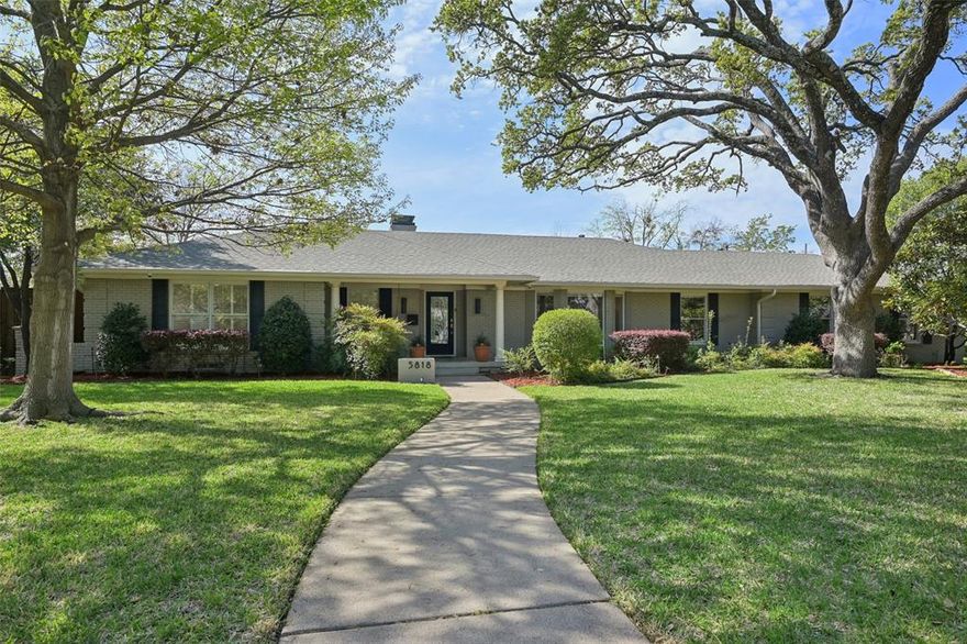 Stunning, thoughtfully designed open-concept home situated on a 120x150 foot lot in one of Dallas’ most sought-after neighborhoods. Built in 1956, this single-story home offers exceptional curb appeal, multiple entertaining spaces, and over 500 square feet of covered outdoor living. Off the entry, you’ll find a formal living room and an inviting family room featuring vaulted ceilings, custom built-ins, and a gas fireplace. These spaces flow seamlessly into the formal dining room and a beautifully appointed chef’s kitchen. The kitchen is equipped with an expansive island, two dishwashers, built-in refrigerator, beverage refrigerator, double ovens, microwave, and an impressive walk-in pantry area with built-ins and a full-size wine refrigerator. An adjoining breakfast room completes the space. Adjacent to the kitchen is a spacious game room with built-ins and a full bath—ideal for entertaining or flexible living. The private primary suite is tucked at the rear of the home, offering serene views of the sparkling pool, plus a generous walk-in closet. The luxurious primary bath features high-end marble finishes, dual vanities, a jetted tub, and a sep shower. Two secondary bedrooms, both with walk-in closets, share a Jack-and-Jill bath, while a third bedroom enjoys access to a full, hall bath. A large utility room, complete with built-ins and a sink, rounds out the interior of this home. The backyard is an entertainer’s dream, showcasing multiple seating areas, motorized screens, a built-in grill, Green Egg cooker, beverage refrigerator, TV, and a wood-burning fireplace. The outdoor living space overlooks the resort-style pool with spa and water feature, along with a generously sized turfed yard. Additional highlights include Sonos speakers in the kitchen, primary bedroom, and patio; oversized 24x27 garage with workspace and storage; a gated driveway; and exterior security cameras. Ideally located near Preston Royal shopping & dining with quick access to the Tollway.