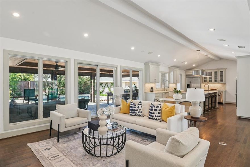 *Back on the market due to no fault of the property.* Stunning, thoughtfully designed open-concept home situated on a 120x150 foot lot in one of Dallas’ most sought-after neighborhoods. Built in 1956, this single-story home offers exceptional curb appeal, multiple entertaining spaces, and over 500 sqft of covered outdoor living. Off the entry, you’ll find a formal living rm and an inviting family rm featuring vaulted ceilings, custom built-ins, and a gas fireplace. These spaces flow seamlessly into the formal dining rm and a beautifully appointed chef’s kitchen. The kitchen is equipped with an expansive island, 2 dishwashers, built-in refrigerator, beverage refrigerator, double ovens, microwave, and an impressive walk-in pantry area with built-ins and a full-size wine refrigerator. An adjoining breakfast rm completes the space. Adjacent to the kitchen is a spacious game rm with built-ins and a full bath—ideal for entertaining or flexible living. The private primary suite is tucked at the rear of the home, offering serene views of the sparkling pool, plus a generous WI closet. The luxurious primary bath features high-end marble finishes, dual vanities, a jetted tub, and a sep shower. 2 secondary bedrooms, both with WI closets, share a Jack-and-Jill bath, while a 3rd bedroom enjoys access to a full, hall bath. A large utility rm, complete with built-ins and a sink, rounds out the interior of this home. The backyard is an entertainer’s dream, showcasing multiple seating areas, motorized screens, built-in grill, Green Egg cooker, beverage refrigerator, TV, and a wood-burning fireplace. The outdoor living space overlooks the resort-style pool with spa and water feature, along with a generously sized turfed yard. Addl highlights: Sonos speakers in the kitchen, primary bedroom, and patio; oversized 24x27 garage with workspace and storage; a gated driveway; and exterior security cameras. Ideally located near Preston Royal shopping & dining with quick access to the Tollway.