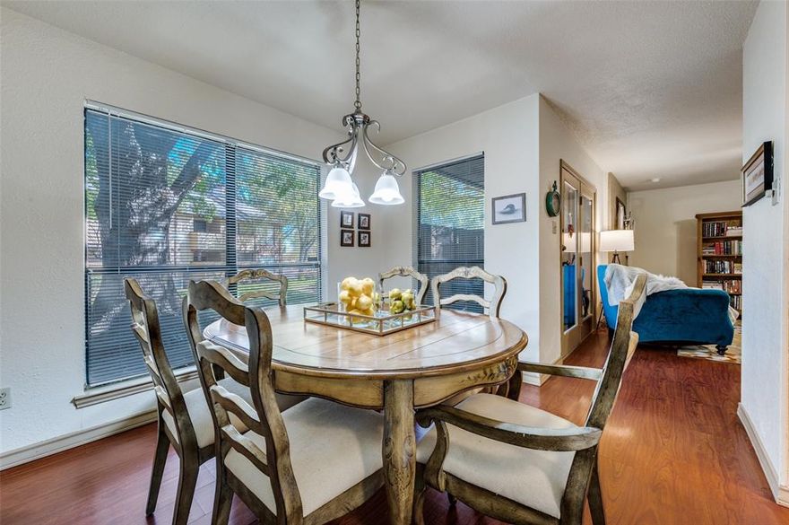 Fabulous Updated Ground Floor Corner Unit by Back Gate! Walk to Dining & Groceries! Perfect for Commuter, Lock n Leave, Parents or Sports Enthusiast! I-30, 183, 161, Globe Life & ATT Minutes Away! Seller ready to Sell! Will pay 6 months of HOA dues! This darling home is ready to move into! Largest two bedroom offers an open plan with lots of windows, great kitchen with rich granite counters and storage for the cook! Separate dining is perfect for entertaining! Living room offers ample room for large pieces! Enjoy a cozy evening by the wood burning fireplace. Cute guest bath offers updated sleek shower tile, shower door, tiled flooring, commode and sink. Amazing Owners Suite boasts two closets, Oversized area for large furniture, office area or reading nook. The gorgeous ensuite bath boasts separate shower, lounging tub, private water closet and great counter space! Guest bedroom offers great closet space too! Rich laminate floors grace the entire home. Enjoy your coffee on the private patio with the morning sun peeking in. A large storage closet is a bonus! Utility closet in hall. The Cloisters offers so much! No reason to leave!! Exercise Room, Sauna, 3 Pools!, Jacuzzi, Indoor Racquetball, Game Area with Card Tables, Tennis Courts plus the community is Gated! HOA dues include Insurance for the Structure, On Site Manager, Ground Maintenance, Water, Sewage and Trash, Full use of Facilities, Pest Control, Landscaping. So much! Two reserved parking spots are yours! Take a tour of this inviting home today!