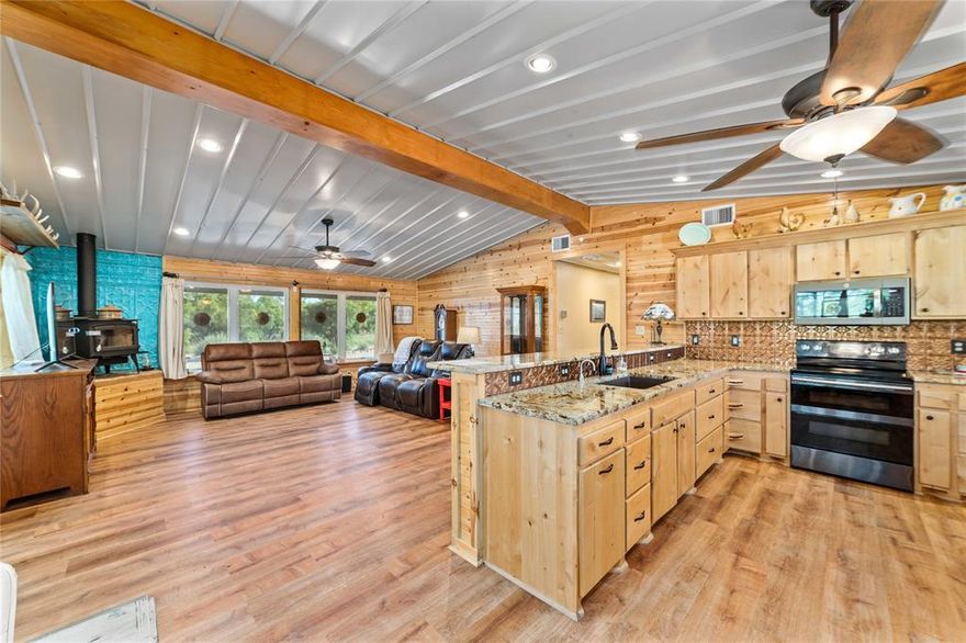 Quiet country living on small acreage in Coleman County, Texas. Located at 970 CR 256, this 3-bedroom, 2-bath home offers privacy and functionality, situated approximately 300 yards off the county road in the middle of a large ranch. The property includes approximately 2 acres (+or -), with additional acreage available.

The home features approximately 2,250 sq ft of living space with central heat and air and a total of approximately 7,500 sq ft under roof. Interior highlights include an open concept living, dining, and kitchen area, wood-burning stove, large walk-in pantry, spacious utility room with mudroom and office space, and a bonus room that can serve as a fourth bedroom, office, or workout room. The master suite includes a large walk-in closet that also functions as a safe room.

Additional improvements include a 1,000 sq ft insulated shop with heating and cooling, 1,000 sq ft garage (3-car capacity), 1,000 sq ft screened-in porch facing east, 500 sq ft enclosed dog kennel, and approximately 1,750 sq ft of covered awnings on the north and south sides.

The home is constructed with a heavy-duty corrugated metal roof and siding for low-maintenance living. The property features a gravel-covered yard area requiring minimal upkeep, native landscaping, and an automatic gated entrance.

Located approximately 9 miles south of Santa Anna, this property offers a quiet rural setting with convenient access to town.