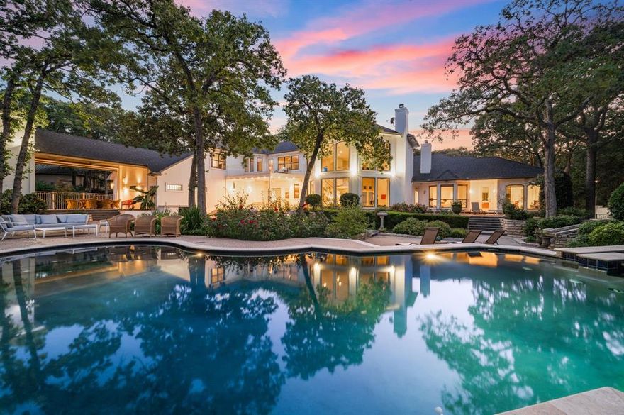 Tucked away in the prestigious Coventry Manor estate, this stunning modern architectural home offers 5 bedrooms, 6 baths, and over 1.1 acres of serene privacy in Carroll ISD. Situated on a spacious corner lot in a quiet cul-de-sac, this residence is surrounded by lush, mature trees, creating a true backyard oasis. Enjoy a sparkling pool and spa with a tranquil waterfall and lighting, perfect for relaxation and entertaining. The home boasts soaring ceilings, abundant natural light, whole-home surround sound, and extensive upgrades, including a brand-new HVAC system (2024) and a roof replacement (2017). Adding to its appeal, a separate 1-bedroom, 1-bath guest house with a full kitchen offers comfort and privacy for visitors or multigenerational living. Designed for both comfort and luxury inside and out, this exceptional property is a rare find in an exclusive setting. Guest house and pool house are included in overall square footage.
