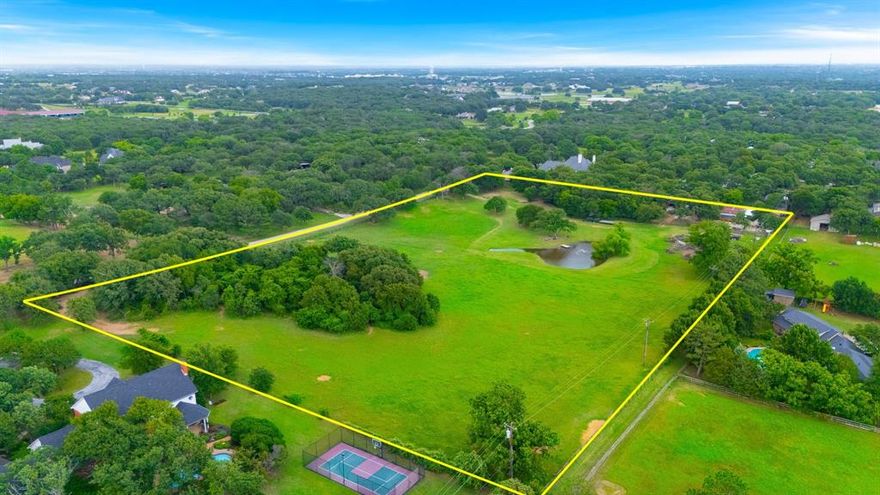 Discover an exclusive 9.88-acre lot in the picturesque town of Flower Mound, conveniently situated just 30 miles northwest of Dallas and Fort Worth. This prime location offers easy access to major highways, making commuting to the bustling DFW area a breeze but tucked away on a quite dead end street with beautiful estate homes nestled on the rolling hills. The lot is perfect for building your dream home and is ideal for horse enthusiasts with access to miles of bridle paths for riding or walking. Enjoy the property's beautiful gentle slope, scenic trees, and a tranquil pond, along with a barndominium or guest home with one bedroom and large open living area. The neighborhood backs up to Tour 18, providing a serene and attractive setting while still being close to the amenities of urban life. Plus, you're just a short drive from the Dallas-Fort Worth International Airport, making travel convenient for both work and leisure. Ag exempt offering lower property taxes. On site water well and community water. Electricity already inlace.