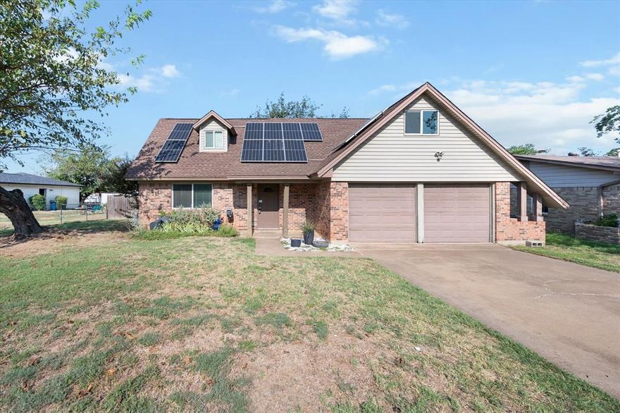 This Kennedale home has tons of space inside and out. SOLAR PANELS FOR ENERGY SAVINGS!! Modern open feel in the living space and kitchen with 1 room down and 2 up.  Modern updated Stainless Steel Appliances and lighting and a renovated downstairs bathroom.  Large lot with storage shed and a Green Room for the Green Thumb in the family.