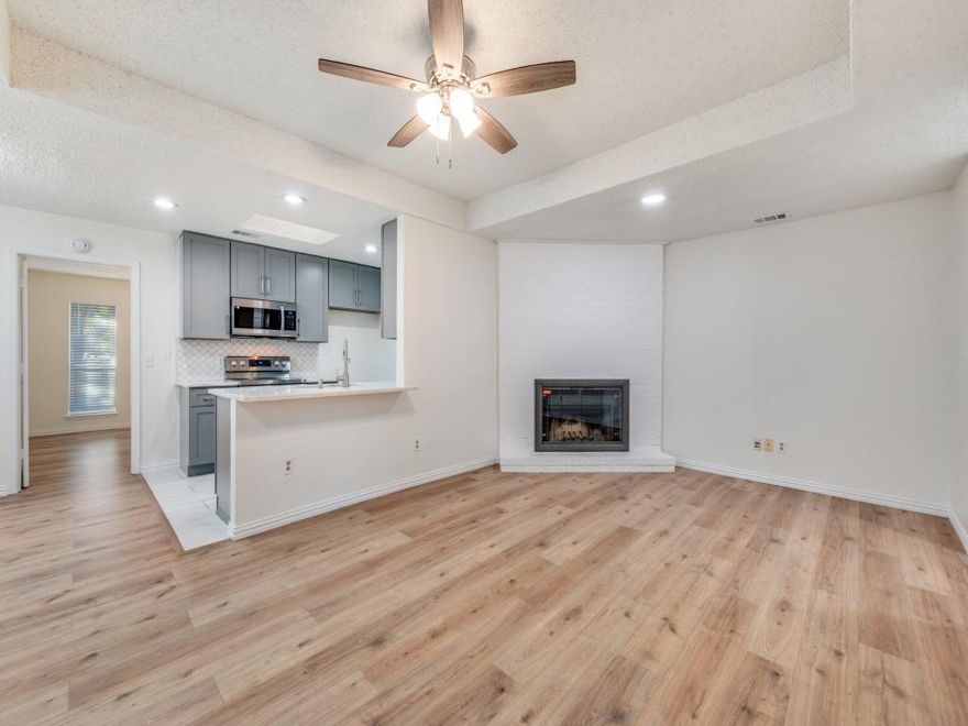 Recently updated, this stylish half duplex in Preston Manor offers a modern, move in ready feel in the heart of Frisco. The open layout includes 2BD, 2BA and 1,196sf of thoughtfully designed living space.  The kitchen features a clean, contemporary look with quartz countertops, a tiled backsplash, abundant storage, and a spacious pantry.  The living area is anchored by a brick fireplace, adding warmth and charm, and enhanced by recessed lighting and updated fixtures throughout.  Both bathrooms have been tastefully refreshed with new tile and modern finishes.  A private fenced patio extends the living space outdoors, ideal for morning coffee or winding down at the end of the day.  Laundry connections are located inside, and the tenant maintains the lawn.  Conveniently positioned near downtown Frisco, Dallas North Tollway, and top shopping and dining.  Available for immediate occupancy.