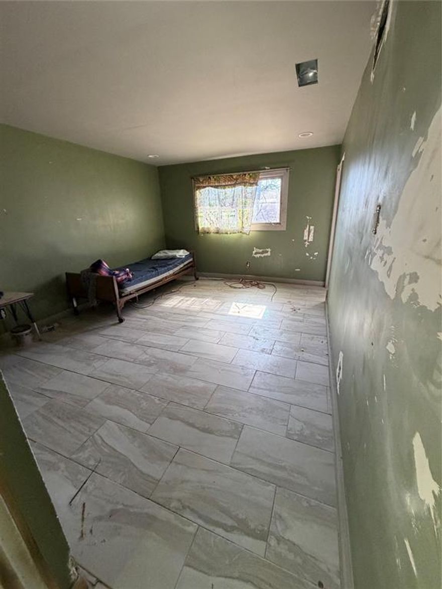 Investment opportunity in an established Arlington neighborhood. Renovation has already been started, offering a head start for investors or buyers looking to complete a project to their own specifications.

The home features a spacious layout with strong bones and a functional floor plan ready for finishing touches. Several updates are already underway, creating the opportunity to add value through completion and customization. Ideal for cash buyers or renovation financing.

Situated on a generous lot with mature trees and convenient access to major roads, shopping, dining, and schools, this property presents solid upside potential in a desirable location.

Property is being sold as-is. Buyer to verify all information.