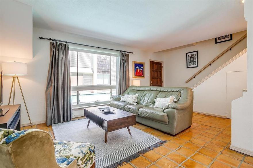 Comfortable living in a quiet neighborhood in the heart of Oaklawn! This two bedroom 1.5 bathroom condo on the 1st floor is move-in-ready. Lots of natural light flows through both floors. Open floor plan with Kitchen overlooking dining and living area. Kitchen has granite countertops, island and pantry and utility area. The Saltillo tile flooring adds a touch of timeless character, giving the space a unique warmth and a nod to classic Southwestern design. Upstairs, the primary bedroom feels like a retreat within itself. A cozy fireplace anchors the space, providing a touch of luxury and warmth on cool evenings. A generous walk-in closet offers plenty of storage, while the stone walk-in shower in the full bathroom elevates your daily routine with spa-like appeal. The secondary bedroom is equally inviting, offering ample space, natural light, and its own walk-in closet, making it versatile enough to serve as a guest room, home office, or creative studio. The dining area is highlighted by French doors that lead out to a private patio, creating a seamless indoor-outdoor living experience. This patio is a hidden gem, ideal for sipping morning coffee, enjoying quiet evenings, or hosting weekend gatherings with friends and family. It’s a true extension of the living space and adds that rare element of privacy that many condo owners desire. Life here also means access to community amenities designed to make the most of your downtime. Just steps from your front door is the sparkling pool, the perfect spot to relax, unwind, and escape the Texas heat without ever leaving the property. The home also comes with one dedicated covered parking space in a secured lot, providing peace of mind and convenience. Location is everything and this condo delivers. Nestled just 2 blocks from the shopping, dining, and nightlife off Cedar Springs, you’ll have it all right at your fingertips. Only 10 min from Love field, SW Medical District, DNT, Downtown, Katy Trail and The AAC.