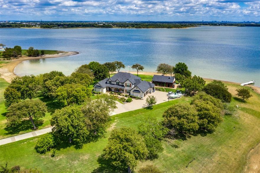 MULTIPLE OFFERS- Highest and Best DUE 5pm CST Sept 8th! Secluded peninsula surrounds a custom built home on 2 acres w 550 feet of lake front. Attached 3 car garage w one bay to accommodate a boat. Enjoy panoramic lake views from 2 family rms, kitchen, breakfast & MB. Upstairs boasts 2 BRs, family room w FP, a huge flex space, and a covered balcony. Light and bright throughout, this home offers 3 living spaces, a formal dining and breakfast dining just off a kitchen beautifully positioned to maximize entertaining. The primary suite highlights an oversized walk-in shower with free standing tub, tons of storage w oversized master closet. Easy access with a circle drive and additional parking on site. Outdoor oasis features an 875 sqft stunning enclosed cabana with central air, wood burning fireplace and full bath, a beautiful pool with grotto and negative edge over the lakeside w hot tub, plus the lush lawn, an outdoor garden, and outdoor gas firepit are perfect for year-round enjoyment.