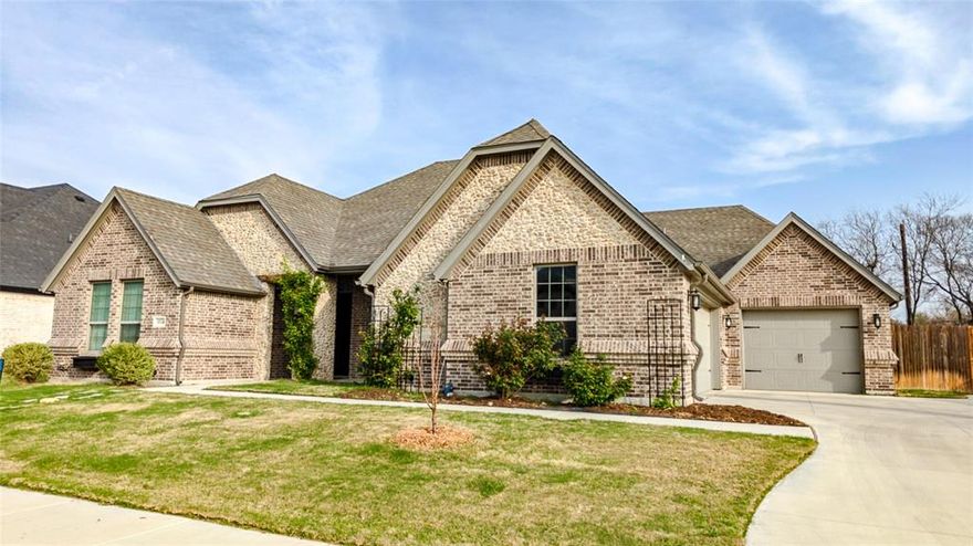 Rare 3-car garage home on an oversized ~.30 acre lot in Spring Ranch Estates! Built in 2019 in highly sought-after Northwest ISD, this beautifully designed home offers ~2,467 SF with 3 bedrooms, 3 baths, a flexible BONUS ROOM, & a spacious open-concept layout perfect for everyday living or entertaining. The kitchen flows into the main living & dining areas with abundant natural light, great prep space, & a cozy wood-burning fireplace. The private primary suite offers a comfortable retreat with an en-suite bath & walk-in closet, while secondary bedrooms provide flexible space for guests, kids, or a home office. The 252 SF BONUS ROOM adds rare versatility as a media room, playroom, gym, flex space, or office. The backyard—on one of the larger lots in the neighborhood—offers plenty of space to relax, play, or design your dream outdoor living area, while the 20-foot covered patio is ideal for entertaining. Mature trees along the rear fence line provide wonderful shade in the summer & beautiful golden foliage in the fall, while climbing English roses and apple trees add charm to the front yard each spring. Just minutes from the Alliance Town Center, major employers, shopping, dining, and entertainment. Homes in Spring Ranch Estates with an oversized 3-car garage, bonus space, newer construction, & a lot this size rarely come available—don’t miss it!