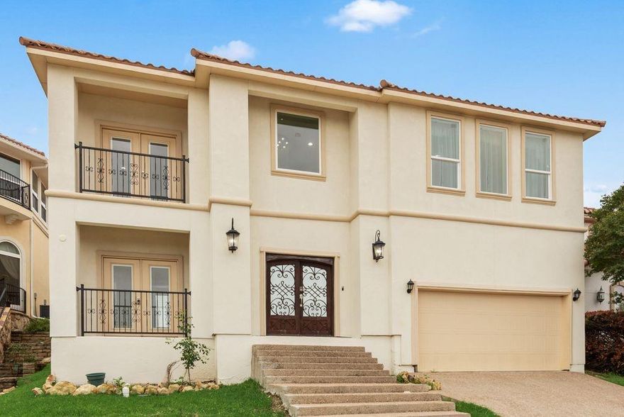 REDUCED!!! IMMACULATE HOME in Lake Country Estates.  Hillside and Lake Views.  Custom home built 2022 with views of the lake in mind.  Primary Bedroom upstairs has a beautiful and breathtaking view of Eagle Mountain Lake.  The other 2 bedrooms upstairs have balcony views and access.  There is one bedroom downstairs that is made as a mother-in-law suite this bedroom has its own backyard covered patio separate from the house patio.  Wide Foyer in the front of the house offers a beautiful staircase made of marble granite steps!!!  The kitchen has an open layout to the living room.  This home has was designed to entertain.  The kitchen has a huge kitchen island and the livingroom a beautiful electric fireplace.  Every room has tile.  all bathrooms have upgraded tile too. Lake access to boat launch and dock.  There are two water heaters and two exterior HVAC units. You need to see this one!