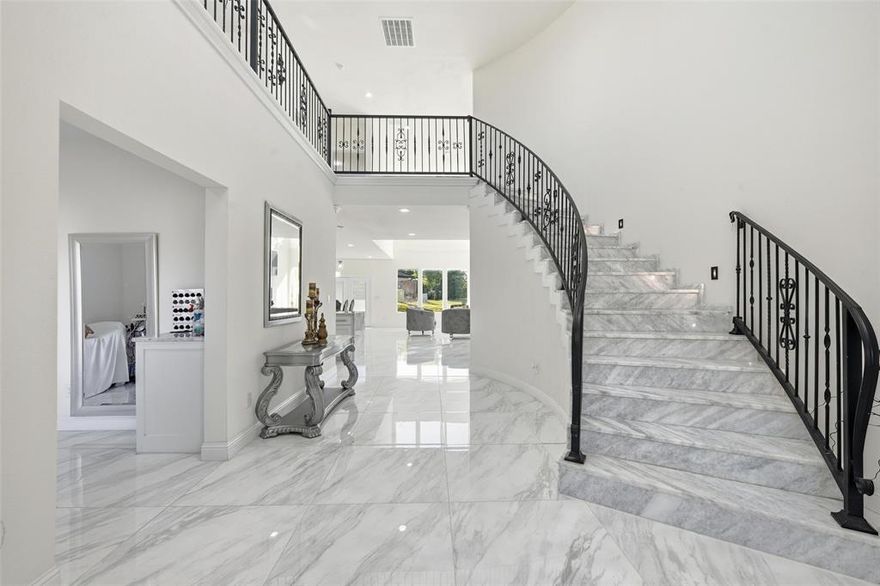 Reduced!  IMMACULATE HOME in Lake Country Estates.  Hillside and Lake Views.  Custom home built 2022 with views of the lake in mind.  Primary Bedroom upstairs has a beautiful and breathtaking view of Eagle Mountain Lake.  The other 2 bedrooms upstairs have balcony views and access.  There is one bedroom downstairs that is made as a mother-in-law suite this bedroom has its own backyard covered patio separate from the house patio.  Wide Foyer in the front of the house offers a beautiful staircase made of marble granite steps!!!  The kitchen has an open layout to the living room.  This home has was designed to entertain.  The kitchen has a huge kitchen island and the livingroom a beautiful electric fireplace.  Every room has tile.  all bathrooms have upgraded tile too. Lake access to boat launch and dock.  There are two water heaters and two exterior HVAC units. You need to see this one!