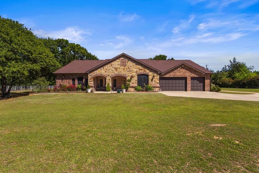 Discover an exquisite country retreat on 4.06 acres in Kaufman County, masterfully designed for equestrian enthusiasts and animal lovers. This exceptional custom-built residence, crafted by the builder as their own home, features four bedrooms, three bathrooms, and a three-car garage, all adorned with luxurious high-end finishes. Every detail is bespoke, from the expansive cedar beams and arched brick-and-stone doorways to the geometric built-ins and chef's kitchen. The home boasts patterned ceramic tile, designer paint and wall treatments, vaulted ceilings, full handicap accessibility, PEX plumbing, and R19-R45 insulation throughout. The meticulously landscaped grounds enhance the home's allure, complemented by an outdoor entertainment pavilion perfect for hosting gatherings or enjoying the serene view of the horses. The property is fortified with robust fencing, including heavy-duty pipe hog fencing, and is securely gated at both the front and back, offering a private sanctuary. Beyond the back gate, a designated area awaits for a large pond, surrounded by perimeter barbed wire fencing, and a 3-stall barn with a central concrete path, ample storage, a tack room, and a veterinary and wash area for your horses. Situated along a picturesque winding road, this property provides easy access to FM 148 and HWY 175, ensuring a convenient commute to the DFW area. A short golf cart ride leads to the Kings Creek Country Club, where you can enjoy golfing, dining, playing pool or bingo, and singing karaoke at your leisure. Conveniently located near dining, shopping, and highway access, this property offers the perfect balance of proximity to the metroplex and the tranquility of country living. Embrace the ranchette lifestyle and bring your horses, goats, cows, chickens, or other livestock. This is a unique opportunity, fully set up and ready for you to enjoy.