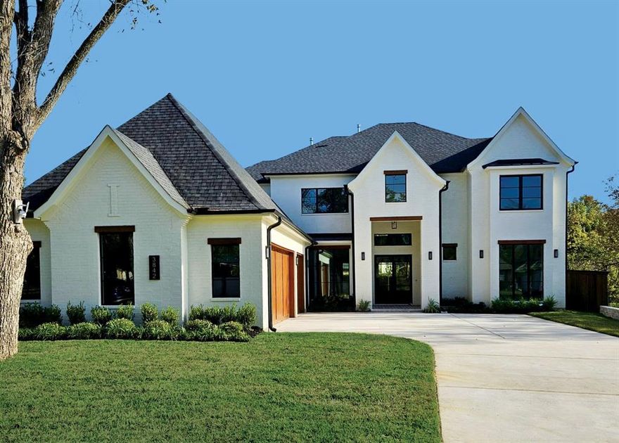 Experience luxury in this stunning new construction home on a 0.32-acre lot in the coveted Midway Hollow neighborhood. The striking facade is enhanced by a three-car garage featuring cedar wood doors.

From the grand porch, you are welcomed into a beautiful foyer. Flanking the foyer, the formal dining room captivates with its soaring ceilings. The open-concept design connects the living, kitchen, and breakfast areas, overlooking a serene backyard through premium Sierra Pacific windows and sliding aluminum doors. The living room boasts striking ceiling beams and beautiful hardwood floors. The gourmet kitchen is centered around a 10-foot waterfall quartz island, a quartz backsplash, and top-tier KitchenAid appliances, including a built-in fridge and a 48-inch gas range. 
The main floor hosts a tranquil primary suite. Its spa-inspired bathroom is appointed with dual sinks, a freestanding tub, dedicated makeup vanity, and a custom walk-in closet. An additional ensuite bedroom, private home office, and a stylish powder bath complete the first level. Ascend to the second floor to a spacious game room, media room, three generously sized bedrooms, and three full baths.

The commitment to quality is evident in foundational elements, including foam insulation in the master suite and porch, three Carrier HVAC systems, two Navien tankless water heaters, a foundation drip system, a smart Rachio irrigation system, and stone retaining wall. Hardwood floors flow throughout the home, except for the media room, to enhance acoustics. The downstairs baths, bar, and fireplace areas are elevated by designer tiles from Porcelanosa, Tile Shop, and Mirrella. Custom white oak cabinetry is featured in the kitchen, master bath, bar, secondary downstairs bath, and mudroom.
The outdoor area offers a covered patio with a kitchen and sink. This home exemplifies exceptional craftsmanship, providing a luxurious lifestyle in one of Dallas’ most desirable neighborhoods. Agent also home builder.