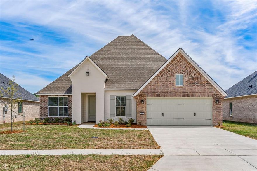 COMPLETE NEW CONSTRUCTION BEAUTY IN SOUTH BOSSIER with $10,000 in concessions offered! Welcome to our ever-popular Tiara with Bonus floorplan built by Southern Home Builders with a charming brick and painted brick front elevation! 317 Peason Ridge is located in The Preserve, a highly sought after new section of The Preserve development in South Bossier known for its convenience to Barksdale Air Force Base and beautiful grounds with sidewalks, green spaces, a fishing pond, a playground with swings, park area, and community events! The Tiara with Bonus floor plan offers amazing bang for your buck complete with 2387 square feet of well utilized footage, 4 bedrooms, 3 bathrooms, a formal dining room, an office with French doors, a 2-car garage, and a fabulous open kitchen and living space! This is not your average spec home with upgrades inside and out including gorgeous quartz countertops in kitchen and baths, crisp white cabinets, neutral and warm trendy wall color, stunning light oak engineered wood floors, gas start wood burning fireplace, built in cabinets and floating shelves on each side of the fireplace, crown molding, cased windows, can lighting, and window blinds already installed (a $1500 value)! Additionally in the kitchen you'll find white cabinets with gold hardware, a beautiful glazed light gray ceramic tile backsplash, and stainless-steel GE appliances with a flat gas range. The primary suite is spacious with plenty of room for all of your furniture, a generous closet, lovely free-standing bathtub, dual sinks, and a fully tiled shower with a bench and frameless glass! Rest easy knowing all systems are brand new and this home comes complete with New Home Warranties, less maintenance and weekend projects! The Preserve is located off Arthur Ray Teague Parkway in South Bossier and super convenient to East Bank District and Shreveport shopping and dining! BUILDER INCENTIVES OFFERED - up to $10,000 to use as you please - closing costs, buy down, or fencing!