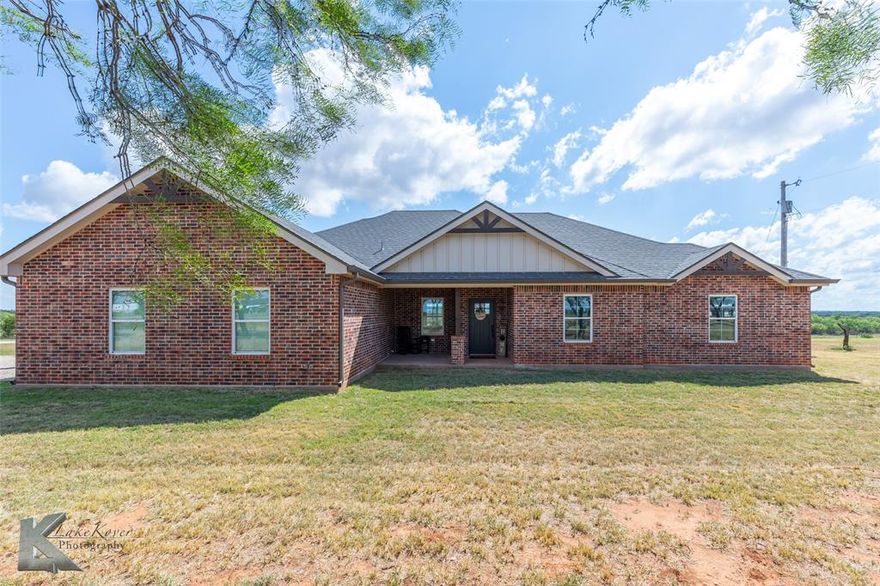 Welcome to 3085 County Road 131 in Tuscola! This beautiful 4 bedroom, 3 bath home sits on 10.5 acres in the highly sought-after Jim Ned CISD. Designed with both comfort and functionality in mind, the home offers an open floor plan with vinyl plank flooring throughout the main living areas and a wood burning fireplace that creates a warm, inviting atmosphere. The kitchen provides plenty of counter space and storage, perfect for everyday living and entertaining. Additional features include a private office, a safe room, a mud room, and an oversized laundry room that adds convenience and versatility to the home’s layout. The split bedroom arrangement ensures privacy, with carpet in each bedroom for added comfort.
One of the standout features of this property is the 1,200 sq ft guest house with its own private entrance. The guest quarters include 3 bedrooms, 1 bath, an open living area, a full kitchen, and laundry space—ideal for multi-generational living, guests, or potential rental income.
With 10.5 acres, this property is ag exempt and perfectly set up for livestock, horses, or simply enjoying wide-open country views. There’s plenty of space to add barns, shops, or outdoor living areas to make it your own. Conveniently located just minutes from Tuscola and a short drive to Abilene, this home combines peaceful country living with modern amenities and accessibility.