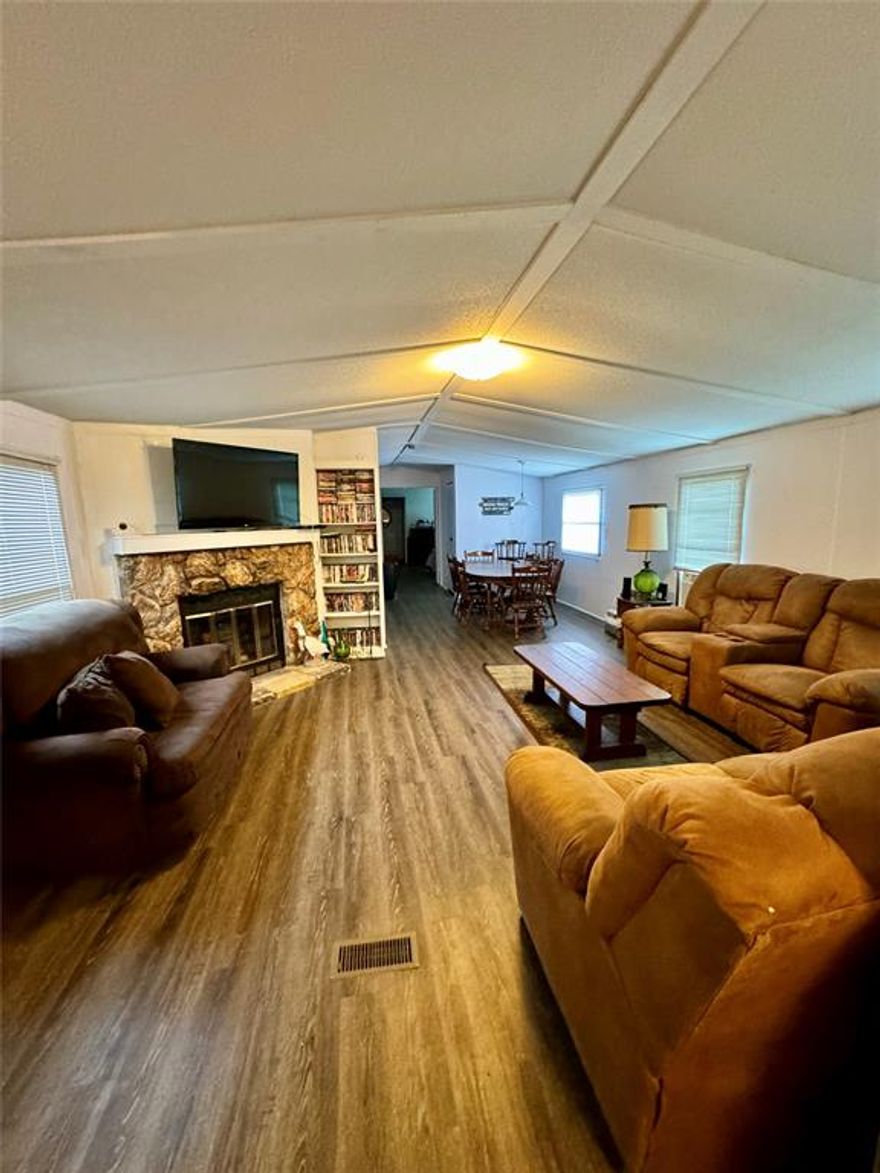 Lake View Mobile Home for Sale! Discover the perfect blend of comfort in this 3-bedroom, 2-bath single-wide mobile home., ideally situated on 3 lots with the view of Cedar Creek Lake. The home features a spacious layout, offering ample room for relaxation. New flooring throughout the house (all the way to the joist), bathroom vanity's are new and house was leveled approximately 4 years ago. Enjoy the convenience of an enclosed single bay shop (18x40) equipped with electricity, perfect for hobbies, storage or a workshop. Weather you're seeking a peaceful primary residence or a weekend getaway, this property provides a serene escape from the everyday bustle. *There is a boat slip for this property and is separate due from the HOA dues.
Additionally, this property presents a fantastic opportunity for investors looking to expand their portfolio. *Additional parcel 3650.0000.0790.30.
BEING SOLD AS-IS.  *NO SURVEY, buyer will be responsible for getting a survey. 
Buyer and buyers agent should do their due diligence in confirming all information is correct.
 *The property can be offered furnished with an acceptable offer.