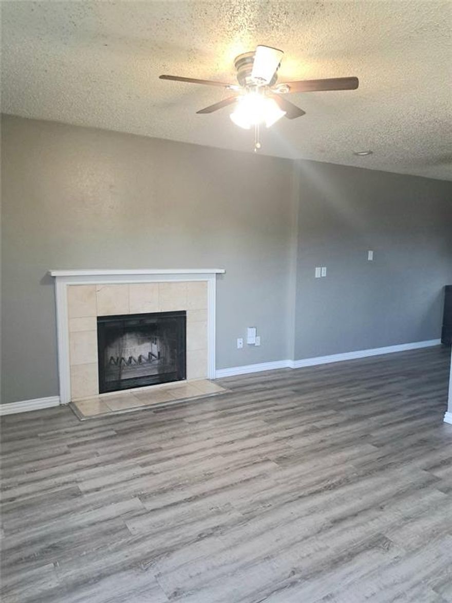 Affordable and super cute 2-1.5 bth townhome on corner lot with 2 covered spaces AND extra parking in back. Unit #A is available. Updated floor plans with laminate flooring throughout. The fireplace makes for a cozy living area. Washer and dryer hook up off the kitchen. #A offers stove, fridge and dishwasher. Units have warm neutral colors though out and lots of natural sunlight.