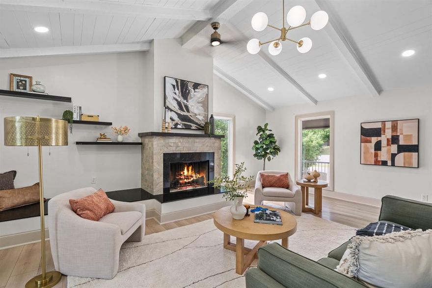 One of a kind retro modern home nestled on nearly ¾ of an acre in one of  Arlington's prestigious neighborhoods.— it feels exactly like a modern treehouse. Cathedral ceilings. Exposed wood beams. A stunning reimagined kitchen with black cabinetry, quartz waterfall island and gold accents, NEW carpet. Two primary suites plus three additional bedrooms. A flex lower level perfect for a game room, gym, office or mother in law suite with its own private entrance. 
Outside- a resort style heated pool and hot tub beneath a canopy of mature oaks, a spiral staircase leading down from the upper balcony. 
Premium upgrades throughout including a new metal roof, copper speckled powder coated gutters, several new windows and new flooring.
This is not just a home. This is an experience