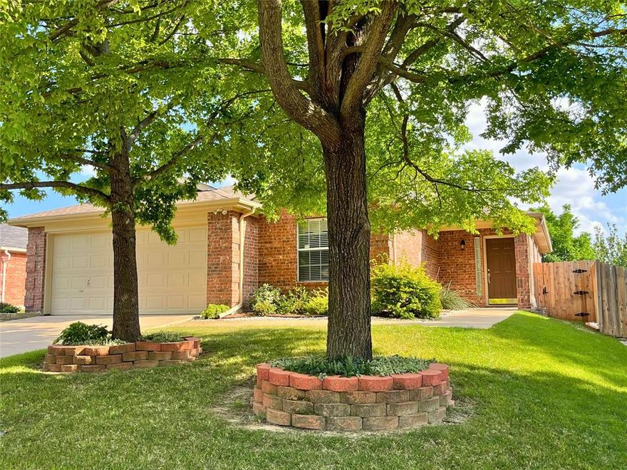 WELCOME TO 4904 MOUNTAIN RIDGE LANE! This 3 Bedroom, 2 Bath One Story Home is conveniently situated in sought after North McKinney with easy access to Highway 75 and US-380, perfect for commuting to Frisco, Plano, and Dallas. Very close to Baylor Scott & White Medical Center, The Heart Hospital, Costco, Kroger, Starbucks, and various popular dining, retail, and shopping options. Features include: Open floor plan connecting living, dining, and kitchen areas. Engineered hardwood floors throughout most of the home and 2-inch blinds. Living room features a classic brick woodburning fireplace with raised hearth and overlooks a beautifully landscaped private backyard shaded by mature trees and ideal for quiet relaxed evenings or for entertaining guests. The spacious primary suite includes 2 walk-in closets, ensuite bath with garden tub, and separate shower. Updates include: Granite countertops in the kitchen, Stainless steel refrigerator (included), new fence, landscaping, and a digital irrigation system, roof replaced in 2025, gutter guards, and 2-inch blinds. Additional Highlights: No HOA, Top-rated McKinney ISD schools. Don't miss this exceptionally well-kept and beautiful home that is move-in ready! Make an appointment to view it today!