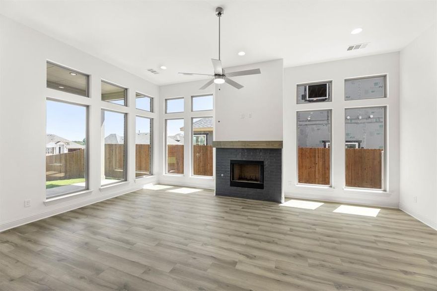 MLS# 20892169 - Built by J Houston Homes - Ready Now! ~ NEW JOHN HOUSTON HOME AT THE PARKS AT PANCHASARP FARMS IN JOSHUA ISD. This gorgeous new floorplan is a stunner with its 12' ceilings throughout and tons of natural light with the beautiful stacked windows in family. This larger 1 story home offers 4 beds, 2.5, baths, covered patio, large pantry and primary closet. The stunning kitchen features custom cabinets with a designer wood hood, built-in appliances, gas cooktop, elegant quartz countertops and a wood wrapped island. Luxurious LVP wood flooring throughout all the main areas and many more quality upgrades. READY in JUNE,JULY.