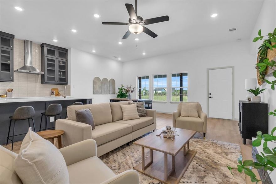 This thoughtfully designed custom home showcases the exceptional quality and attention to detail of a residence originally built for the builder's personal use. Sitting on OVER 2 ACRES, this property boasts a serene pond with its own island, home to fish, adding to its charm. The entire lot is fully fenced with an electric gate for added privacy and convenience. Offering 3 bedrooms, 2 bathrooms, and a dedicated office, it’s perfect for working from home or hosting. Designed with energy efficiency in mind, the home features spray foam insulation to help reduce utility costs. The kitchen is a chef’s delight, with custom soft close cabinetry, quartz countertops, and a self cleaning microwave wall oven for added convenience. Storage is abundant, with numerous closets throughout the home and an oversized laundry room. The primary walk-in closet is a standout feature, offering custom-built cabinetry for organized and stylish storage. The 2 car garage provides ample space and is prewired for electric vehicles. Animals are allowed and survey is included. Home comes with a home warranty for added peace of mind.