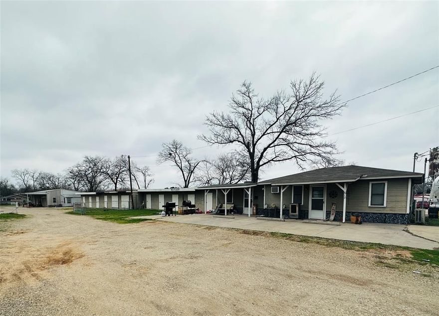 Unique investment and development opportunity.  This property offers a rare combination of flexibility, location, and potential for various business ventures.  Whether you are looking to start or expand your business, lease out the existing units, or explore future development opportunities, this property delivers.  
*  Three Bay Shop - Water, electric, and ideal for a variety of commercial uses.
*  Two Apartments - (1) 2 bedroom 1 and one-half bath unit (2) 1 bedroom 1 bath unit 
*  11 Storage Units
Extra space on property currently leased out for equipment and trailer storage.


Note:  Roof being replaced on storage building.