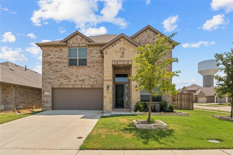 Beautiful north-facing 5-bedroom, 4-bath home with a 2-car garage, perfectly situated on a desirable corner lot overlooking a peaceful neighborhood lake and located near the area’s large scenic lakes. From the moment you arrive, you’ll appreciate the charming curb appeal and the relaxing water views right outside your door.

The main floor offers a spacious primary suite with a luxurious private bath, plus a versatile guest room or office and an additional full bath. The open-concept kitchen, dining, and living areas are ideal for entertaining, featuring abundant natural light and seamless flow for gatherings with family and friends.

Upstairs, you’ll find three generous bedrooms, two full bathrooms, and a large game room wired for speakers and a projector—perfect for movie nights, gaming, or adding a pool table for fun evenings at home.

This home is loaded with upgrades, including beautiful wood-look tile flooring, elegant wrought iron spindles, stainless steel appliances, a tankless water heater, radiant barrier for energy efficiency, and an extended patio with a pergola to enjoy the outdoors year-round. A full sprinkler system makes lawn care a breeze.

Conveniently located near I-35E, Walmart, popular restaurants, and within walking distance to Founders Classical Academy—plus just minutes from the region’s largest lakes for boating, fishing, and weekend adventures. Built by D.R. Horton, this home combines comfort, style, and location into one perfect package.