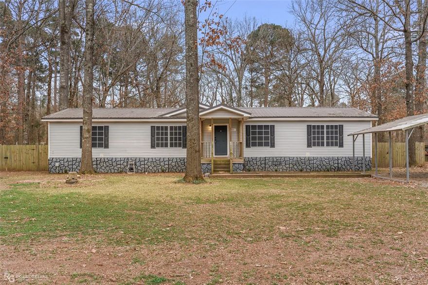 Lovely home nestled on nearly an acre of land with views of Cypress Black Bayou plus HOA dues provide access to the private community boat launch, pier, and pavilion! This property is perfect for those who love the outdoors - the backyard is fully fenced with a wood privacy fence and has ample space for cultivating a garden, installing a fire pit, or maybe even a pool! The storage shed offers room to store your equipment and the large, practically brand-new covered back deck is the perfect spot to host summer BBQs or simply enjoy time outside. Inside, this home offers plenty of room for hosting gatherings, with an open and airy floorplan. The living room flows seamlessly into the dining area, complete with a cozy corner fireplace. The kitchen continues off of the dining space and features stainless appliances, abundant cabinets, and a center island. The spacious 3 bedrooms offer plenty of room for family and guests and the two full baths ensure privacy for everyone. A separate dedicated office ensures you will have room to work in peace. With all of these great amenities, this home is sure to impress, so schedule your private tour today!