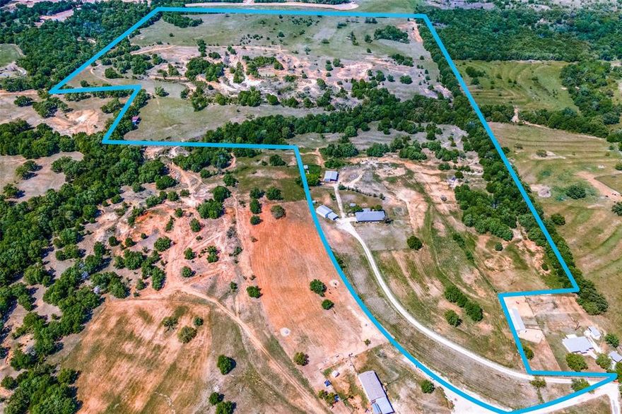 Gorgeous acreage just north of town. 88.957 +- acres. Property features the best of all worlds with trees and open fields for farming. This land has been hunted, grazed, and farmed. Beautiful views of the horizon for miles. Custom built home features 4 bedrooms 2.5 baths with second living room with wet bar, and enclosed patio garden room. Numerous built ins through out. One owner and well cared for and designed. Large kitchen with peninsula for extra seating and newer stainless appliances. 2 car garage is heated and cooled. 30x40 metal shop with loft area for extra storage, and a roughed in bathroom ready to complete. 4 pipe pens, 50x100 metal barn for livestock or hay storage. Additional metal barn on the back of the property for equipment and hay storage. Fenced pasture land. 3 stock tanks that hold water. Electricity has been brought to the back of the property. Too much to list, a must see!