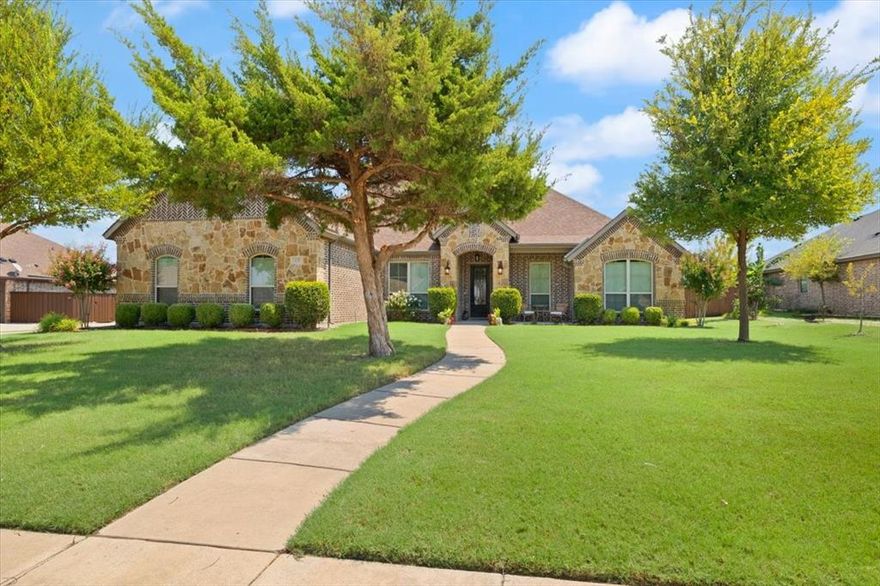 Discover this beautifully maintained, 1.5 story home in the highly sought after community of Ovilla Parc. Offering 4 BR + a Private STUDY, 3 Full Baths, 2 Living Rooms Down and an Upstairs Media-Bonus Room, 3-Car Garage & POOL. Spacious lot .362 Acres.  Gorgeous Hand scraped Hardwood Floors lead to the study with French doors. They continue into the inviting open concept layout filled with natural light.  Beautiful stone wood burning Fireplace is a cozy feature in the main living room. The Spacious Kitchen has an Island-Bkfst Bar, granite countertops, 42 in. custom cabinets to ceiling with frosted glass fronts for display. The Primary Suite is split from the other rooms for added privacy and offers two vanity areas, separate shower-Garden tub and a Walk in closet. Need a space for MIL or a Multi Gen setup? This home has a Bedroom with a Living Area & Private ensuite Bathoom.  Spit from that are two additional spacious bedrooms separated by the third full bath. Your upstairs Media room is a blank canvas for what your family needs. Step outside and enjoy extended living, offering a Cedar Pergola covered Flagstone Patio and Diving Pool with a Waterfall feature. 30 minutes to Dallas and 45 minutes to Fort Worth, allows for a quick commute and a short drive to come back home to this quiet established neighborhood. See Virtual Tour