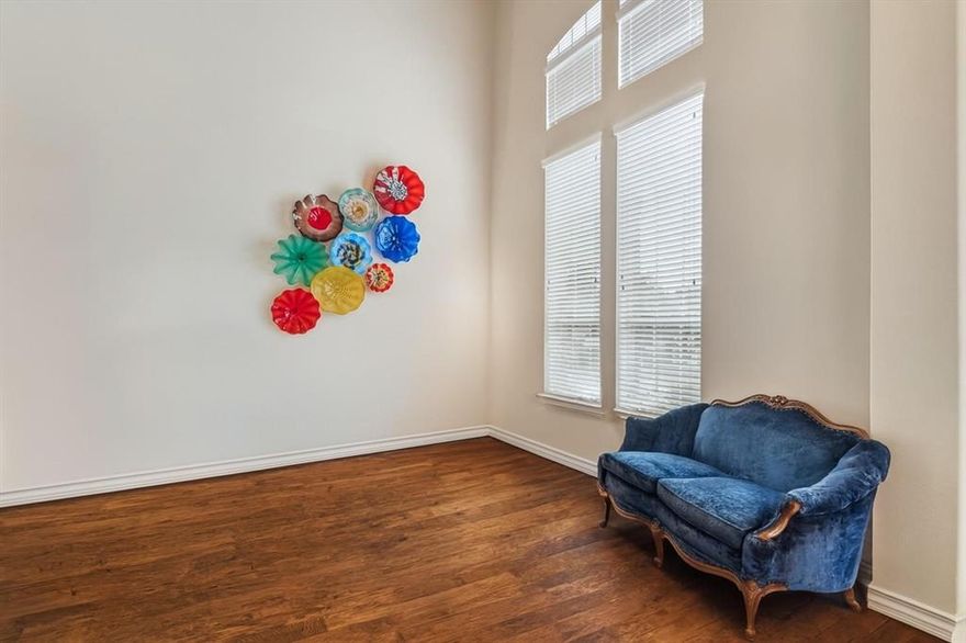 Step inside and admire all that this beautiful Grand 2 story home has to offer: five bedrooms, four full baths, and an open design layout with soaring vaulted ceilings in the sitting and living rooms. Natural light floods the space through abundant windows, creating a warm and inviting atmosphere.
The formal dining room provides an elegant setting for entertaining, while the kitchen boasts built-in cabinets, five burner gas cooktop, double convection ovens, expansive counter space, accent lighting, and a breakfast nook—perfect for casual meals. The kitchen overlooks the spacious living room with a unique custom gas fireplace, cut outs with upgraded puck accent lighting, and wall plugs on every wall. Situated just off of the living room, the primary suite features a spa-like master bathroom with dual sinks, a separate shower, and a soaking tub. Also downstairs is a second bedroom with a nearby hall bathroom. Step outside to the covered back patio, equipped with gas hookups for outdoor cooking, perfect for hosting gatherings. Jellyfish lighting beautifully illuminates the exterior, while French drains in the backyard ensure proper drainage. The lush St. Augustine grass, mature trees, professional landscaping, and knotless cedar wood fence enhance the curb appeal. Upstairs, enjoy a spacious game room, a dedicated office or media room, three additional bedrooms, and a Jack-and-Jill bathroom. Surge protector added to the electrical panel, solar window screens on southside windows, and many more upgrades to see. Located close to highways 635, 30, and 190, this home offers easy access to major routes. Plus, Lake Ray Hubbard is just a short drive away, providing stunning scenery and recreational opportunities. Public record has the total building Sq Ft is 5,091.