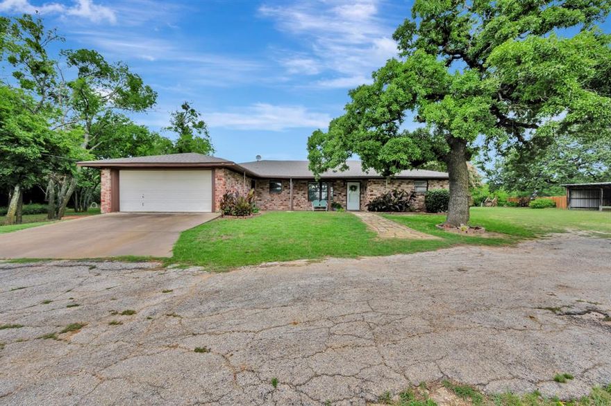 **Better than new** Whether you're looking for a peaceful retreat, a place for animals, or room to grow, this property has it all. The property features a 24x30 steel shop equipped with electricity, perfect for projects, storage, or hobbies. The home offers a warm and inviting living space, and each bedroom has its own private bathroom along with a convenient half bath for guests. The primary suite includes dual closets and a completely remodeled bathroom with a stunning spa-style shower featuring a multi-jet shower head and wand. The kitchen is bright and functional with stainless steel appliances and plenty of cabinetry, opening to a charming dining area with arched pass-throughs. Outside, you'll find an abundance of mature shade trees, a raised garden bed ready for you to grow anything you desire, a spacious outdoor living area, and plenty of room to roam. The property is fully fenced and includes a three-stall barn. Horses are welcome here. This is a rare opportunity to own nearly 3 acres just minutes from Fort Worth with convenient access to Chisholm Trail Parkway. Schedule your showing today and experience the possibilities.