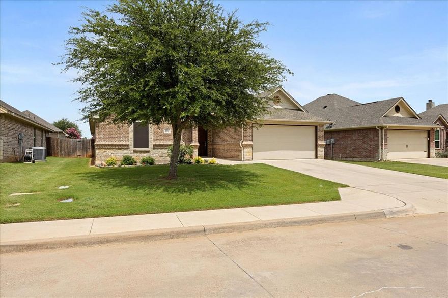 LOCATION, LOCATION, LOCATION! Beautiful home in sought-after Ashley Oaks! Well-maintained and move-in ready, this 3-bedroom home is ideally located on the Fort Worth side—perfect for commuters. Enjoy nearby shopping, dining, and entertainment, all just minutes away.

Wide neighborhood sidewalks are perfect for evening strolls. Inside, the spacious kitchen features solid wood cabinets, granite countertops, stainless steel appliances, and an eat-at island. All three bedrooms offer walk-in closets. The attic is spray foam insulated for excellent energy efficiency. Additional features include city water and sewer, high-speed internet and cable access, security system, sprinkler system, and a garage with opener. The large fenced backyard and covered back porch are ideal for relaxing or entertaining.

Discover thoughtful extras throughout--nowhere is left to guess when it comes to comfort and convenience. With sidewalks, kids can safely ride or play. This move-in ready home is ready to support your family's next chapter.

Don't miss this blend of energy efficiency, solid construction, and charm-- schedule your showing today!