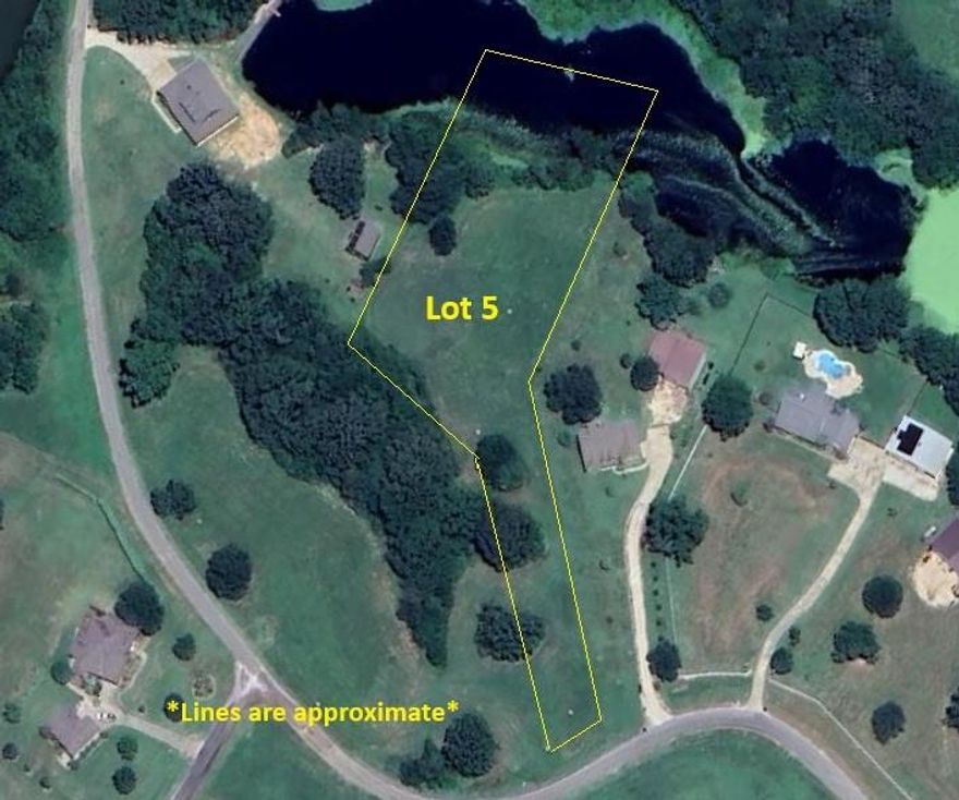 Build your dream home in the highly sought-after Lake Fork Ranches at Star Ranch! Lot 5 on County Road 1300 offers 2.191 acres of peaceful East Texas countryside with a beautiful private pond setting and close proximity to world-famous Lake Fork. This unique property sits back from the road, allowing you to create a homesite tucked behind mature trees for added seclusion from the road and charm. The lot is level and ready for construction, making it an ideal canvas for your custom home or weekend retreat. Enjoy the best of both worlds—quiet country living with the convenience of being just minutes from Lake Fork’s renowned fishing, boating, and outdoor recreation. Whether you're ready to build now or planning for the future, this property offers location, privacy, and natural beauty all in one. Don’t miss this opportunity to own a slice of East Texas paradise!
