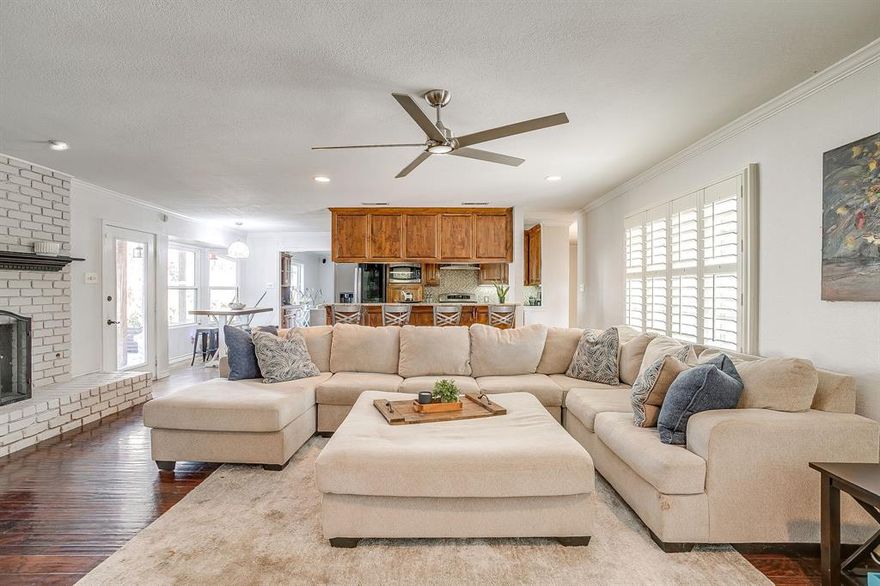 Set along one of Ridgmar’s picturesque, tree-lined streets, this thoughtfully designed home offers a rare blend of space, comfort, and flexibility on over one-third of an acre! Perfectly suited for a wide range of lifestyles, this home delivers generous living spaces and an inviting layout that works for families, downsizers, or anyone looking for room to spread out. Inside, two distinct living areas create natural separation and flow, allowing for both lively gatherings and quiet moments. A timeless brick fireplace anchors the main living space, providing warmth and character for cozy evenings or entertaining guests. The second living area features a dry bar and a large window overlooking your private outdoor oasis, making it ideal for game nights, casual entertaining, or simply relaxing with a book. The kitchen is both beautiful and functional, with granite countertops, stainless steel appliances, and abundant storage. Its open connection to the main living spaces makes cooking, hosting, and day-to-day routines effortless. Each bedroom is generously sized, offering privacy and versatility. The primary suite is a true retreat, with an en-suite bath featuring a large walk-in shower and a spacious walk-in closet. Additionally, a secondary primary bedroom with its own en-suite offers the perfect private space for guests, extended family, or older children. Step outside to a backyard designed for both fun and relaxation. A sparkling pool and spa provide a private retreat for warm Texas days and peaceful evenings, while the covered patio is ideal for BBQs and outdoor gatherings with friends and family. For those who love projects, hobbies, or extra storage, the property also includes a fully gated workshop with heat, air, and electricity. Perfect for work or play. Located in the heart of Ridgmar, this home combines established neighborhood charm with convenient access to shopping, dining, and entertainment. Only minutes from Lockheed, JRB, Downtown and Shady Oaks CC.