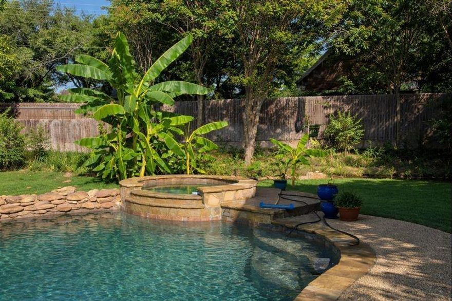 Set along one of Ridgmar’s picturesque, tree-lined streets, this thoughtfully designed home offers a rare blend of space, comfort, and flexibility on over one-third of an acre! Perfectly suited for a wide range of lifestyles, this home delivers generous living spaces and an inviting layout that works for families, downsizers, or anyone looking for room to spread out. Inside, two distinct living areas create natural separation and flow, allowing for both lively gatherings and quiet moments. A timeless brick fireplace anchors the main living space, providing warmth and character for cozy evenings or entertaining guests. The second living area features a dry bar and a large window overlooking your private outdoor oasis, making it ideal for game nights, casual entertaining, or simply relaxing with a book. The kitchen is both beautiful and functional, with granite countertops, stainless steel appliances, and abundant storage. Its open connection to the main living spaces makes cooking, hosting, and day-to-day routines effortless. Each bedroom is generously sized, offering privacy and versatility. The primary suite is a true retreat, with an en-suite bath featuring a large walk-in shower and a spacious walk-in closet. Additionally, a secondary primary bedroom with its own en-suite offers the perfect private space for guests, extended family, or older children. Step outside to a backyard designed for both fun and relaxation. A sparkling pool and spa provide a private retreat for warm Texas days and peaceful evenings, while the covered patio is ideal for BBQs and outdoor gatherings with friends and family. For those who love projects, hobbies, or extra storage, the property also includes a fully gated workshop with heat, air, and electricity. Perfect for work or play. Located in the heart of Ridgmar, this home combines established neighborhood charm with convenient access to shopping, dining, and entertainment. Only minutes from Lockheed, JRB, Downtown and Shady Oaks CC.