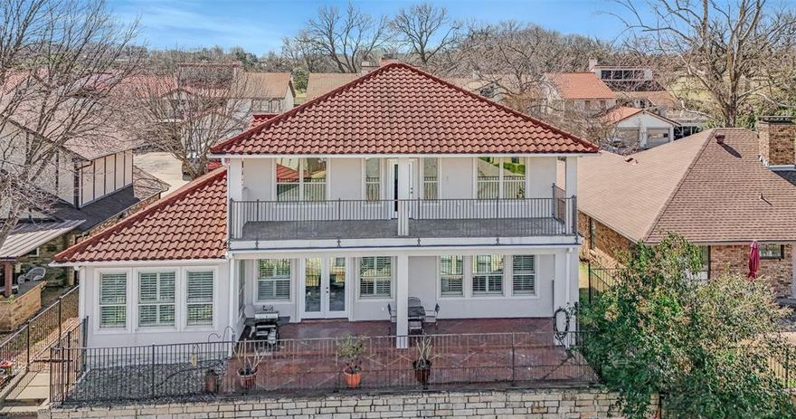 GOLFERS this one is for you! Located in a gated community with a nine-hole golf course. You don’t have to reserve a tee time or pay extra….just walk on and play! This exquisite mediterranean style custom built home is a haven of comfort and entertaining. Offering over 2790sqft of living area with 4 bedrooms one currently being used as an office and 4 baths with soaring high ceilings and a spacious layout that invites natural light to sweep through every corner. The heart of this home is its grand kitchen, a culinary dream that leads to the spacious balcony for amazing sunsets offering lake views from both the first and second-floor balconies. Primary bedroom located on the first floor has a custom walk in closet with unique features including pull downs. Second floor has a secondary living space with two en-suite bedrooms with walk in closets and ample storage. The over size garage tops it off with extra room for storage, tools or a golf cart to explore the neighborhood.The gated subdivision offers a 9 hole golf course, pool, cabana, playgrounds, tennis and basketball courts as well as boat and RV storage