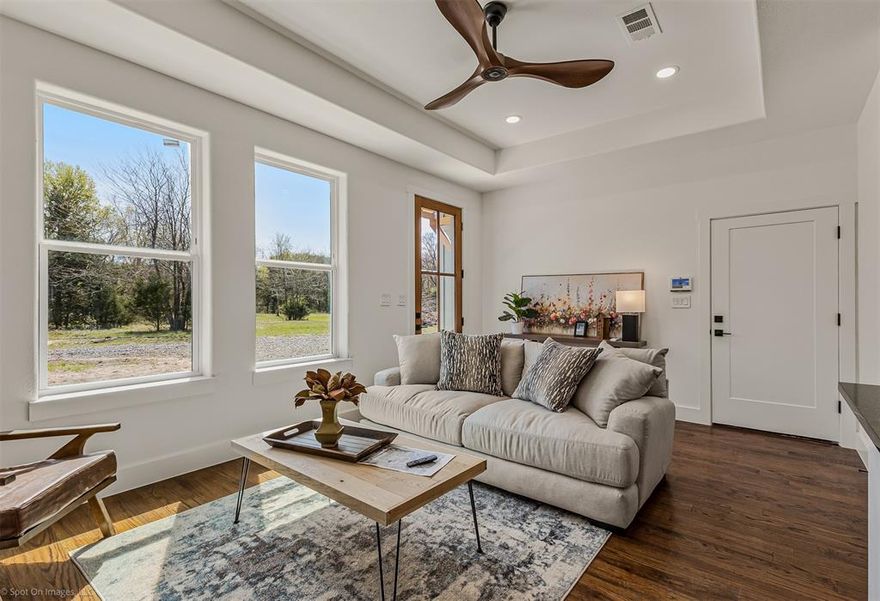 Live smart now… build big later.
Welcome to your barndominium with living quarters, perfectly positioned in Wolfe City, just a short distance to the new Lake Ralph Hall and one mile from charming Ladonia, Texas. Nestled on 5 private, tree-lined acres, this peaceful retreat gives you the rare opportunity to live comfortably while planning and building your dream home. A tranquil creek along the back of the property adds that extra touch of Texas serenity.  Step inside the living quarters and you’ll find a thoughtfully designed space with custom finishes throughout. Enjoy 9 foot ceilings that create an open, airy feel, paired with hand scraped red oak hardwood floors that bring warmth and character. The custom kitchen features quality cabinetry, sleek quartz countertops, and a layout built for both everyday living and entertaining. The bathroom showcases custom tile work and a spacious walk in shower. Central heat and air keep things comfortable year round, with propane available for added efficiency in heating and cooking.  Now let’s talk about the real showstopper… the barndominium itself. This structure isn’t just a place to live, it’s a lifestyle. The attached 800+ square foot insulated shop offers incredible flexibility with 12 foot ceilings, making it ideal for hobbies, storage, business use, or future expansion. Foam  insulation throughout the entire building enhances energy efficiency and comfort.  The land is where your vision takes flight. With 5 acres of usable space, you have room to build your dream home, add a horse barn, create outdoor living areas, or simply enjoy the wide open Texas sky.

Opportunities like this don’t land often… live in it, love it, and build your future right here.