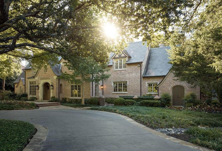 Timeless, Tudor gated estate on serene 2.05 acres in the heart of Old Preston Hollow with tennis court, pool, cabana and dry creek. Designed by Larry Boerder and built by Cy Barcus Sr, this 6 bed, 6.3 bath property blends classic style and lush surroundings into a truly special opportunity. The entry is flanked by formal dining and a wood-paneled library. Large family room features vaulted ceilings, fireplace and overlooks the grounds. Kitchen opens to a large breakfast area that opens to the family room. 1st floor primary includes office, large bath, and 2 walk-in closets. Upstairs, 5 large suites plus a playroom, addl flex space, and half bath. 3rd floor has storage, addl flex space or gym. Outside amenities include large grassy front lawn, covered porch, gas grill, pool, spa, cabana with living area and full bath, fire pit, and a charming bridge over a dry creek bed to the tennis court! This property embodies Dallas estate living in the most premier location in Old Preston Hollow.