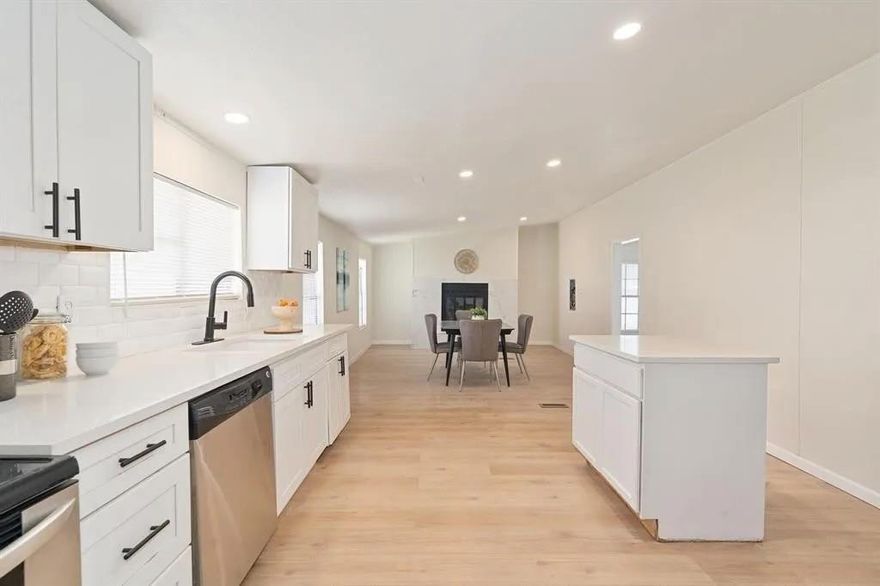 Spacious home on nearly half an acre with large front windows, beautiful views, high ceilings, and a great layout that creates an open, airy feel throughout.