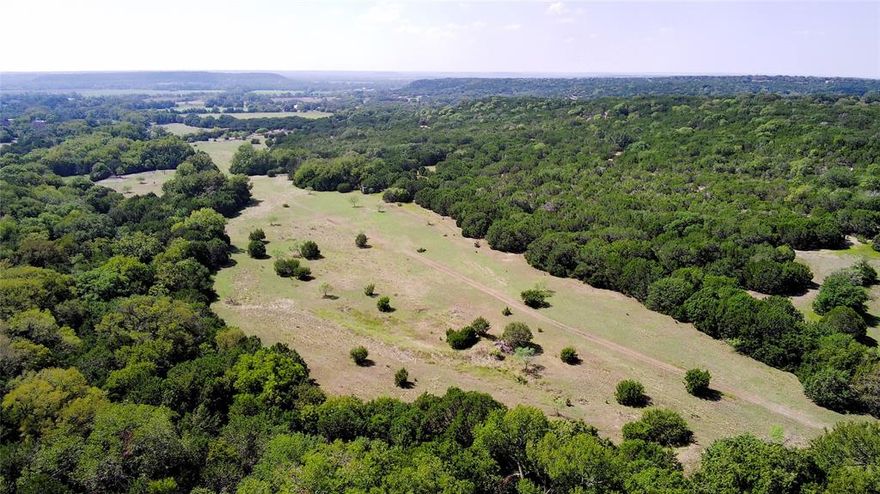 The Pickens Ranch is nearly 300 acres of beautiful multi-use land less than 30 miles southwest of downtown Waco that is ideal for recreation, residential, agriculture, or potential rural development. The property is defined by two heavily wooded ridgelines along the east and west sides of the property with over 100’ of elevation change and miles of ATV trails that connect multiple small pastures and open fields already set up for hunting. There are also multiple small stock tanks and potential stock tank locations dispersed throughout both ridgelines and small draws that feed into the wet-weather creek. In between the two ridgelines is a valley and wet-weather creek, lined with countless native pecan trees, that traverses the middle of the property from north to south. The property has remained in the current family for the past 40+ years and has been well-managed for deer hunting, producing numerous trophy bucks as well as turkeys, hogs, and predators.