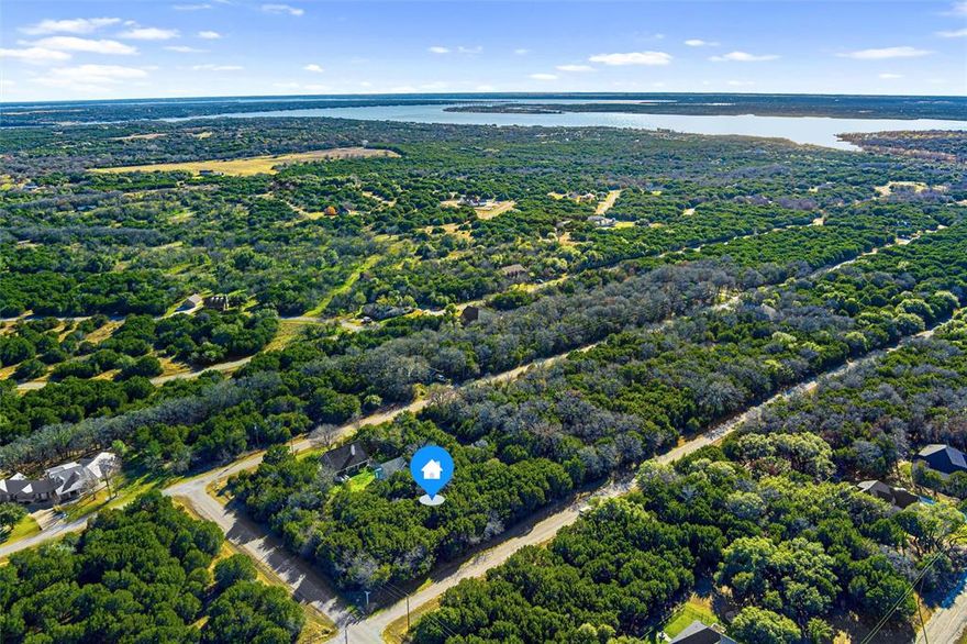 PRICE REDUCTION 
Spacious Wooded Lot in White Bluff Resort, Lake Whitney
Discover the perfect location for your dream home or vacation retreat in the serene White Bluff Resort. Nestled on the shores of Lake Whitney and just 75 minutes from the DFW area, this spacious wooded lot offers the ideal blend of convenience and tranquility. Whether you seek full-time living or a weekend getaway, the resort’s beautiful surroundings and extensive amenities provide everything you need for a comfortable lifestyle.
Explore all that White Bluff Resort has to offer, from its stunning lake views to its top-tier facilities.