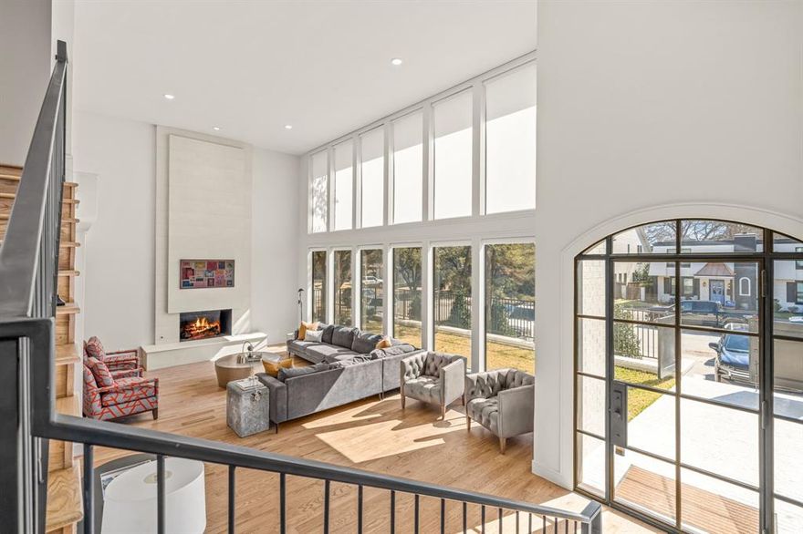 Just steps from Rivercrest Country Club, this fully renovated and expanded 4-bedroom, 4.1-bathroom home offers 4,344 square feet of thoughtfully designed living space. Renovated by Randall Sears with interior design by Jessica McIntyre, the home blends elevated finishes with functional elegance.

The main level features soaring ceilings in the foyer and living room, a showstopping kitchen with Taj Mahal quartzite countertops and full-height backsplash, top-of-the-line appliances including a Wolf range and built-in Jenn-Air refrigerator, and a full wet bar with wine fridge and ice maker. Enjoy everyday meals in the spacious kitchen dining area and host guests in the formal dining room that seats up to 10.

The primary suite is a true retreat with a spa-like bath—complete with soaking tub, rainfall shower, dual vanities, and custom walk-in closet. A downstairs guest suite lives like a second primary. Automatic blinds add convenience throughout the main living spaces, along with a chic centrally located powder bath.

Upstairs offers two additional bedrooms, two full baths (including an en-suite), and a versatile media room that could easily serve as a home office. A newly built rooftop deck expands the living space.

Outdoor features include a private elevated courtyard, a side yard with artificial turf and a putting green, and a grassy backyard area perfect for pets. A two-car garage with fresh epoxy floors and bonus front parking completes this exceptional property.