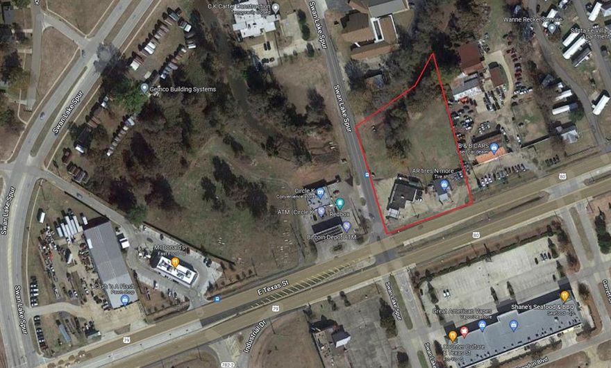 The perfect commercial location - almost 2 acres of mostly cleared land - conveniently off of E Texas St and just minutes from I20 - adjoining 3 acres also available - come and see this great opportunity for your business today!!
