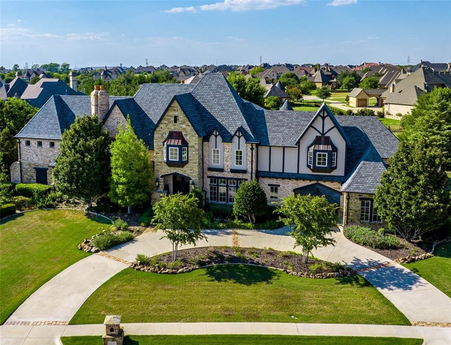 Luxurious French Tudor Estate in Exclusive Kingsbridge! Step into a world of refined sophistication as you enter this colossal and inviting estate. Every detail has been meticulously curated, including hand-scraped hardwoods, rich knotty-alder cabinetry, upscale finishes, vaulted, beamed ceilings, and Juliet balconies in grand foyer. Chef's kitchen boasts arched entryways and a butler's pantry. Main floor features a wine grotto, home theatre, & magnificent owner's suite with gorgeous en-suite, private sitting room, and a 2-story closet! Second split guest suite with ensuite bath, an appointed office, and half bath complete the main floor. Second level boasts 3 additional bedrooms, each with ensuites, a game room and 2nd laundry closet! Outdoor oasis features heated pool-spa, stone water features, privacy landscaping, kitchen, & living space with fireplace for unforgettable gatherings! 4-car garage is accessed through a porte-cochere, adding more elegance to this spectacular property!