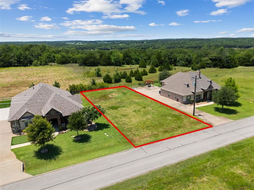 Don't miss this incredible opportunity to own a piece of paradise in the exclusive Rock Creek Resort on Lake Texoma—where luxury, nature, and lifestyle come together like nowhere else! 

This beautiful interior lot on Palisades Circle is build-ready with no required build timeline, giving you the freedom to design your dream home on your terms while enjoying immediate access to world-class amenities. Rock Creek is a gated, resort-style community packed with value—a Jack Nicklaus-designed golf course, a private marina with boat rentals and slips, resort-style pool, full-service spa and fitness center, clubhouse with upscale dining, tennis and pickleball courts, scenic hiking and biking trails, and year-round social events that create a true sense of community. 

Whether you're planning your forever home, a weekend retreat, or a long-term investment, this is your chance to secure a lot in one of North Texas's fastest-growing luxury lake destinations—just one hour from the DFW Metroplex! Utilities are already in place, and HOA dues cover gated security, amenity access, and maintenance of common areas. Lots like this are limited and going fast—take the first step toward the lifestyle you've been dreaming of at Rock Creek Resort!