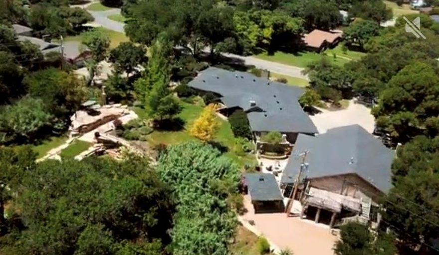 Executive Resort!! Texas Style!! This one of a kind estate blends rustic charm with modern luxury. This property features 3 distinct homes each crafted with its own style.  Outdoor living is the center of this property design with two outdoor kitchens, spacious covered patios and multiple dining and lounging areas designed for year round entertainment. Two fire pits offers the perfect spot to gather under the Texas stars or to enjoy the sound of a cascading waterfall off you porch. This 1.42 acre lot  gives you a chance to stroll down rock pathway to  a pergola area for a quiet creek retreat.  The main house is a sprawling one story, warm yet elegant home. Warm accents, rich mesquite wood floors, a stone accent wall and stone fireplace create a loving family gathering place.. This is a huge room opening into the dining rooms and kitchen. Granite gourmet kitchen with gas stove, wine refrigerator and ice maker. Attached to the main house is the new almost complete 1 bedroom one bath apartment. Pictures to come when finished. It boasts a den and island kitchen all in one room with a wall of windows.  If the outdoor living spaces doesn't grab your heart, then the MANCAVE will!   This mancave is straight out of a Texas Hunting lodge. Upon entry you are greeted by a 2 story high red cedar ceiling, stone walls and mounted game trophies. Lions tigers and Bears OH MY !!  A stone fireplace is the center of this massive room with an open bar kitchen. The bathroom showers are crafted out of stone and walls and staircase  carve wood. The mancave can sleep up to 13 people. Covered carport can fit 4 cars but the driveway  can park 17 pick ups. This can be your resort home .This estate is more than a home, it's a destination, offering friends, family a chance to relax and experience the best of Abilene. The  Mancave is 2322 sq ft  of living space not included in listing.  A property video can be found on YOUTUBE  under Don and Debbie Steeles Rental Property at 1201 Leggett Dr.