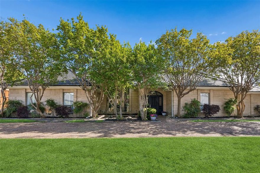 Impeccably maintained and thoughtfully designed, this luxury 3-bedroom, 4.5-bath residence captures the essence of refined Dallas living with a seamless blend of comfort and sophistication. Designed with hosting in mind, the home offers an exceptional setting for both intimate gatherings and larger-scale entertaining, all enhanced by impressive designer touches throughout. The expansive main living area is anchored by a striking see-through wood-burning fireplace and framed by large windows that invite in natural light while showcasing views of the outdoor retreat, complete with a sparkling pool, spa, and inviting patio—ideal for both entertaining and everyday enjoyment. Rich hardwood flooring enhances the warm, elegant atmosphere throughout. The well-appointed kitchen balances style and functionality with granite countertops, built-in appliances, generous storage, and a charming breakfast nook featuring custom built-ins. The private primary suite offers a peaceful retreat with a coffered ceiling, sitting area, plantation shutters, and a spacious ensuite bath with dual sinks, separate vanities, a separate shower, and a walk-in closet. Secondary bedrooms are thoughtfully arranged in a three-way split layout, each with its own ensuite bath and walk-in closet, providing comfort and privacy for a variety of living arrangements. A secondary living area, enhanced by a skylight, offers a warm and elegant setting ideal for relaxing or gathering with guests, highlighted by rich architectural details and an inviting ambiance. Natural light fills the home, creating a welcoming and airy environment. The beautifully landscaped grounds enhance curb appeal and offer a serene setting for outdoor living. A three-car tandem garage and a versatile floorplan complete this exceptional property, designed to accommodate a range of lifestyles with ease and elegance. 3D tour available online!